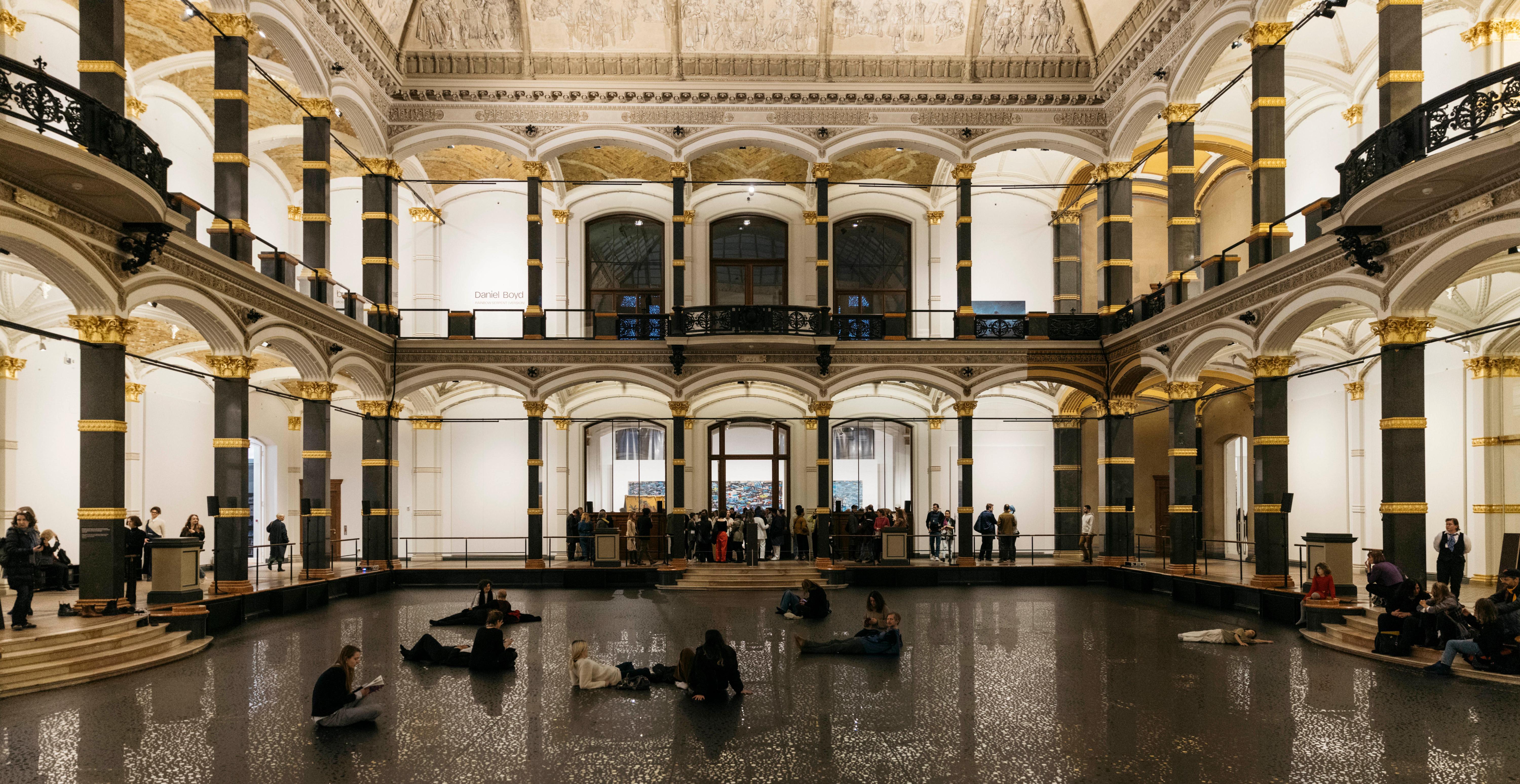The atrium of the Gropius Bau. The floor is covered with a reflective foil as part of the Daniel Boyd's exhibition "RAINBOW SERPENT (VERSION)".